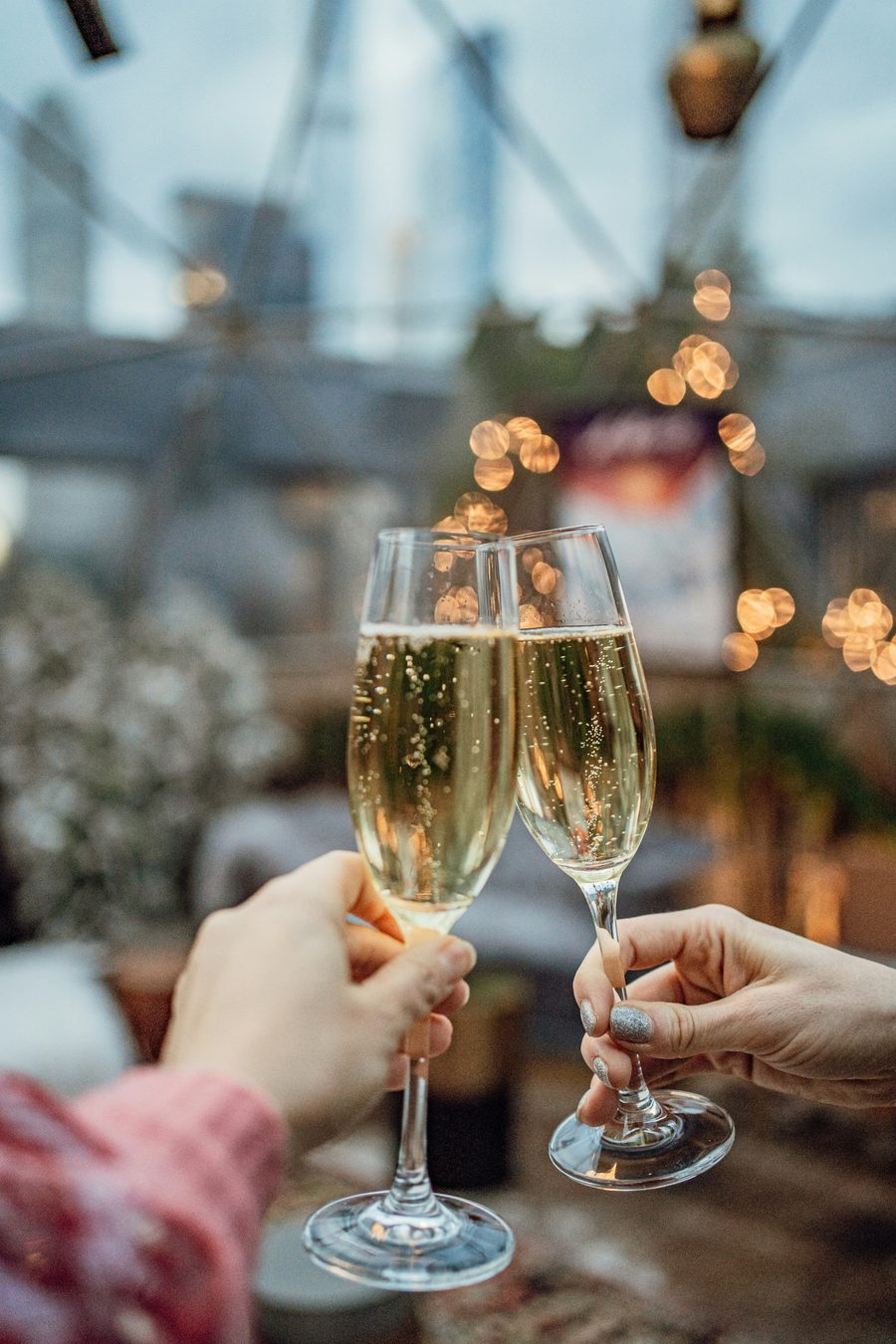 Champagne toast with sparkling lights